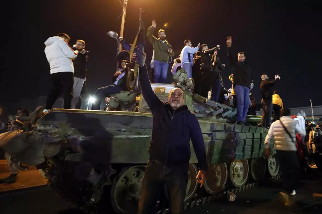 Syria latest: Syrians celebrate Bashar Assad's fall as his whereabouts remain unknown