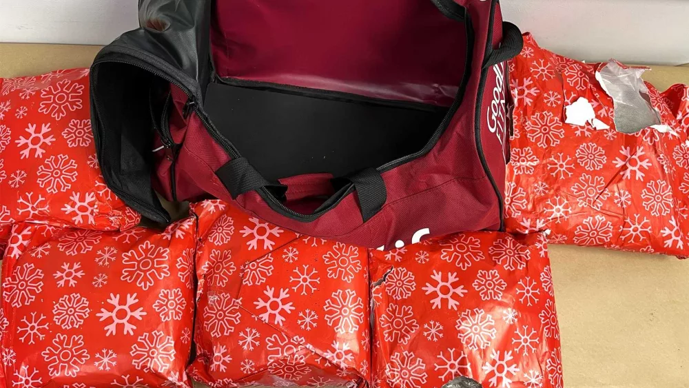 Woman arrested with 22 pounds of meth wrapped as Christmas presents at airport