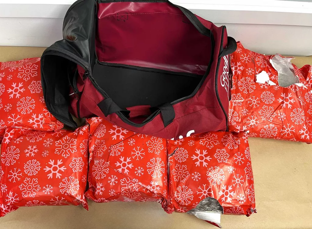 Woman arrested with 22 pounds of meth wrapped as Christmas presents at airport