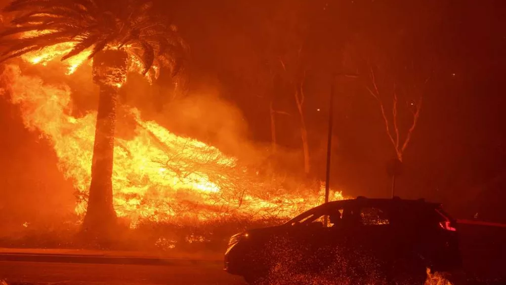 Malibu wildfire grows, thousands remain evacuated but firefighters will break from improving weather