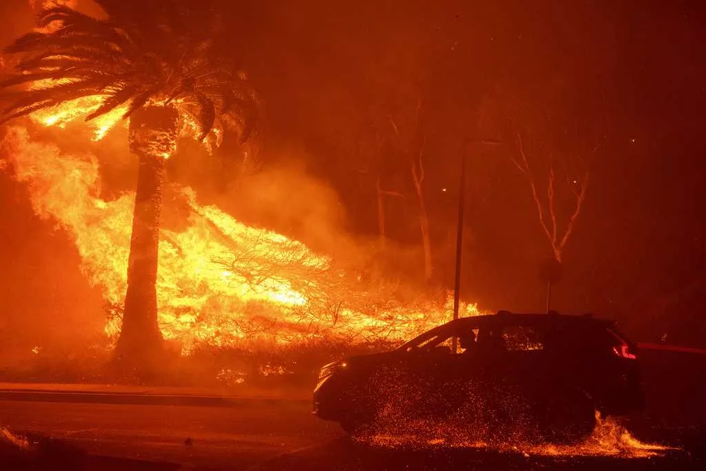 Malibu wildfire grows, thousands remain evacuated but firefighters will break from improving weather