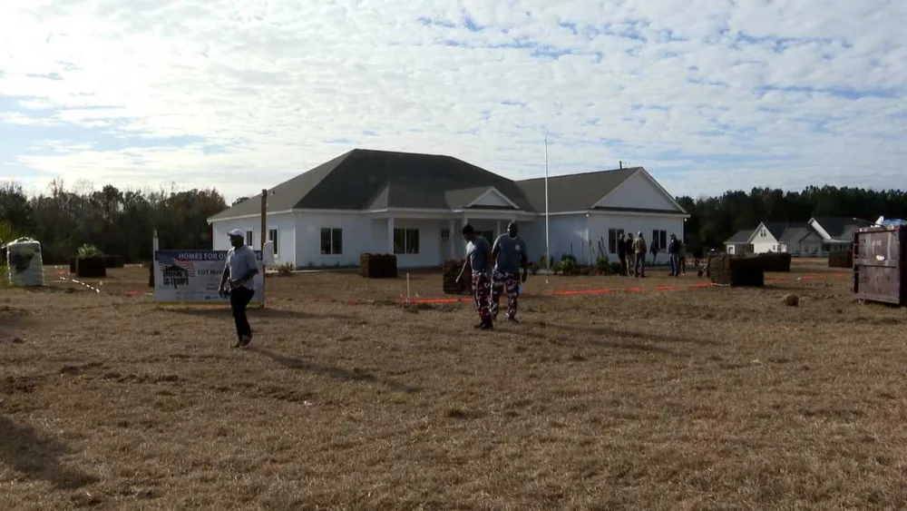 Volunteers help with landscaping at home for a veteran in Effingham
