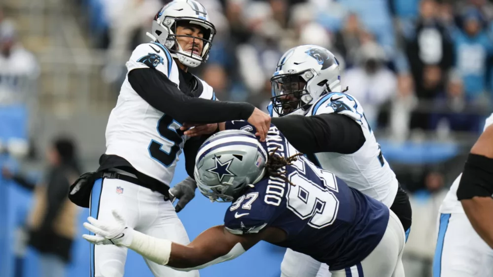 Rush throws for career-high 3 TDs, Cowboys force 4 turnovers to beat Panthers 30-14