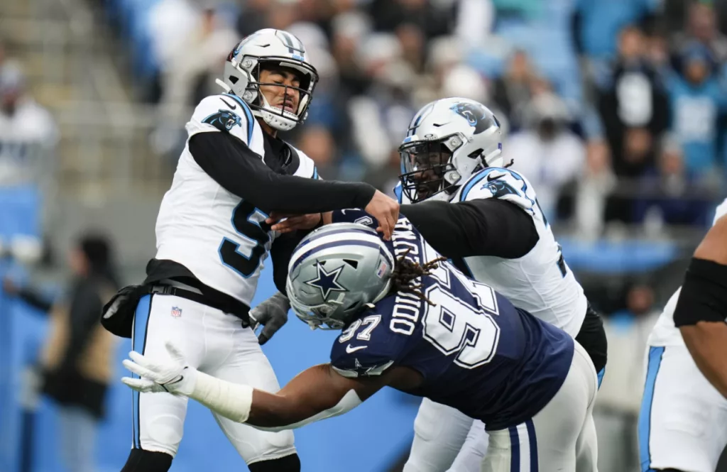 Rush throws for career-high 3 TDs, Cowboys force 4 turnovers to beat Panthers 30-14