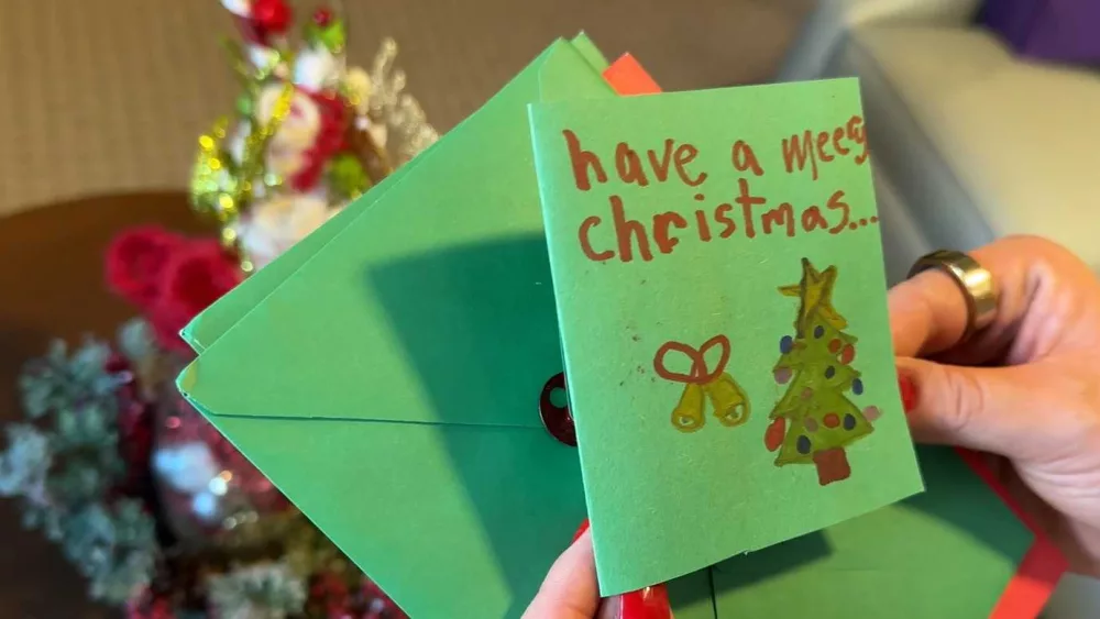 Students make Christmas cards for residents at senior living community