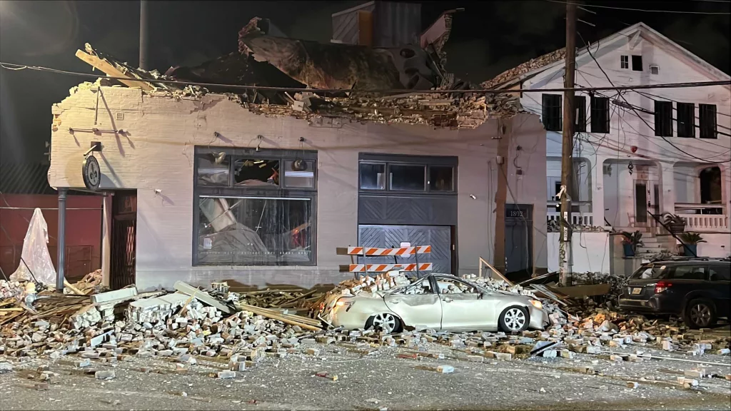 Partial building collapse causes power outages, vehicle damage