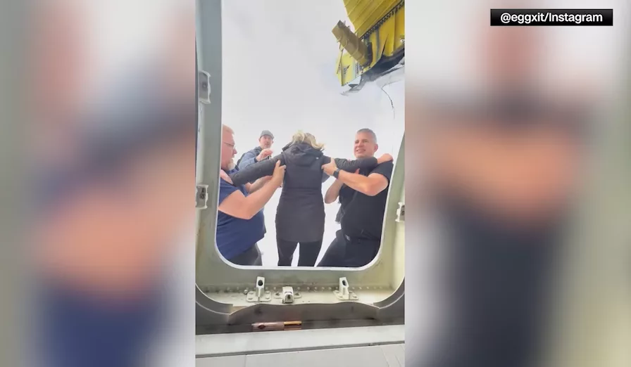 Video: Passenger records themselves crawling out of overturned Delta flight in Toronto