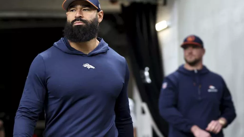 Broncos coach arrested after being accused of punching police officer