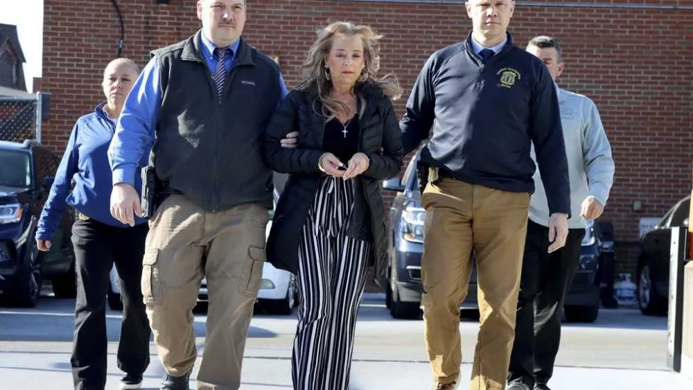 Police charge stepmother after emaciated man says he was held captive for more than 20 years