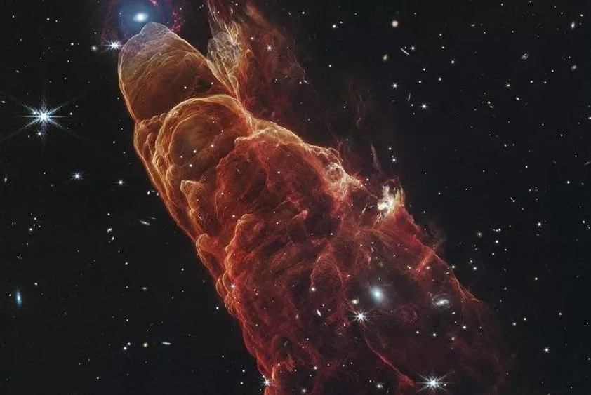 Webb Space Telescope captures a star in the making and a galaxy far, far away