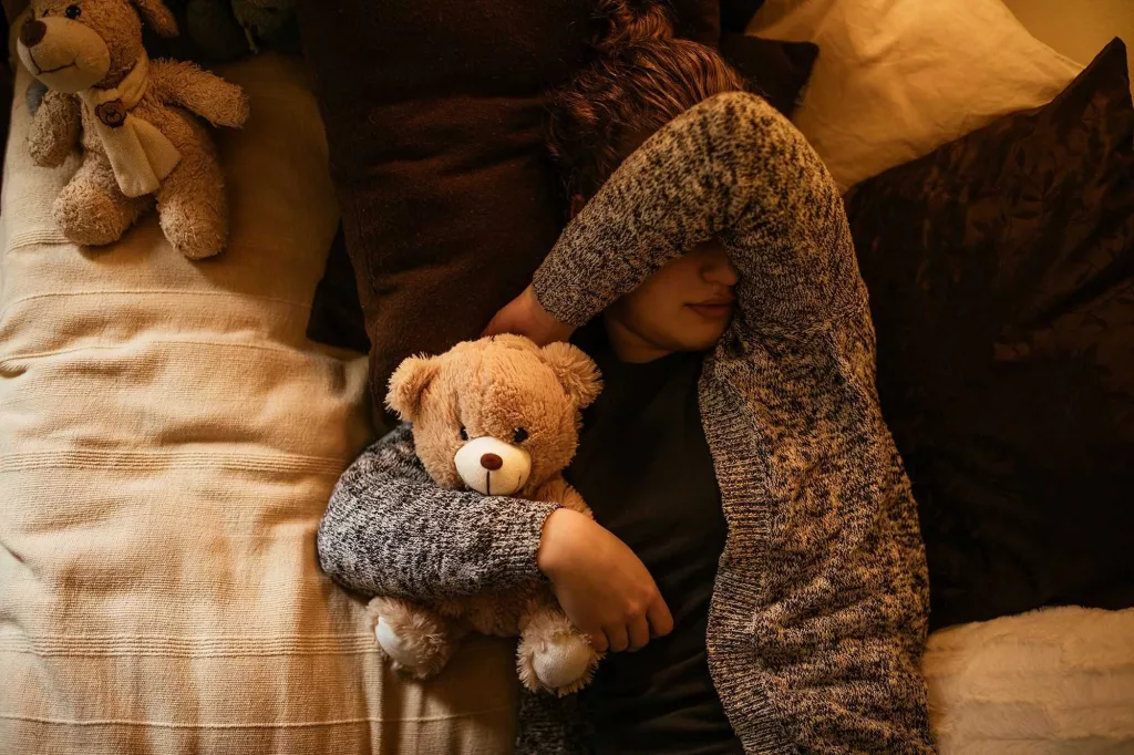 Adults can sleep with stuffed animals, too. It might even be a good thing, experts say