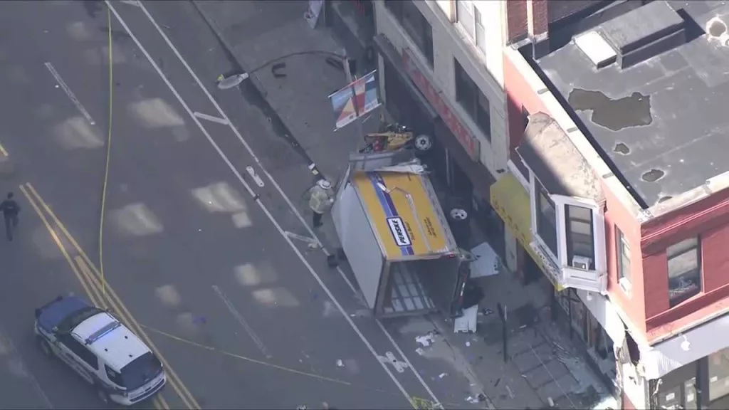 At least 6 people hurt when box truck crashes, overturns on Boston sidewalk