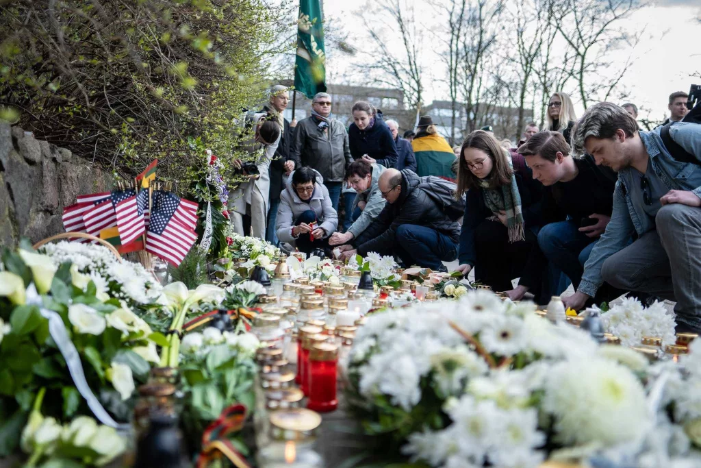 Crowds gather outside U.S. embassy in Lithuania to honor fallen Fort Stewart soldiers