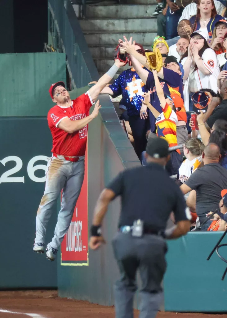 Fan controversially rips ball from Mike Trout's glove