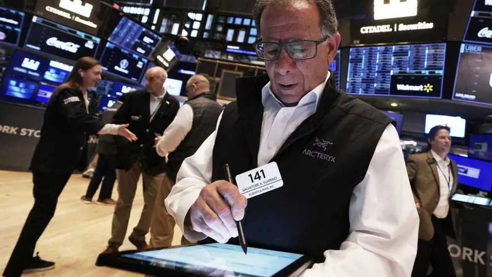 Wall Street and the dollar tumble as investors retreat further from the United States