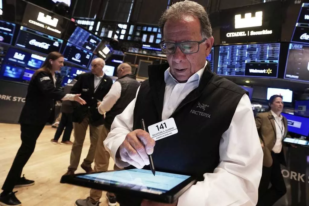 Wall Street and the dollar tumble as investors retreat further from the United States