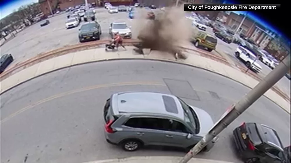 WATCH: Mother and her kids narrowly escape a manhole explosion