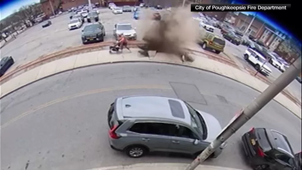WATCH: Mother and her kids narrowly escape a manhole explosion