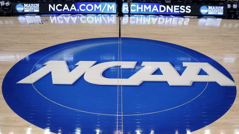 NCAA approves historic rules allowing colleges to pay athletes