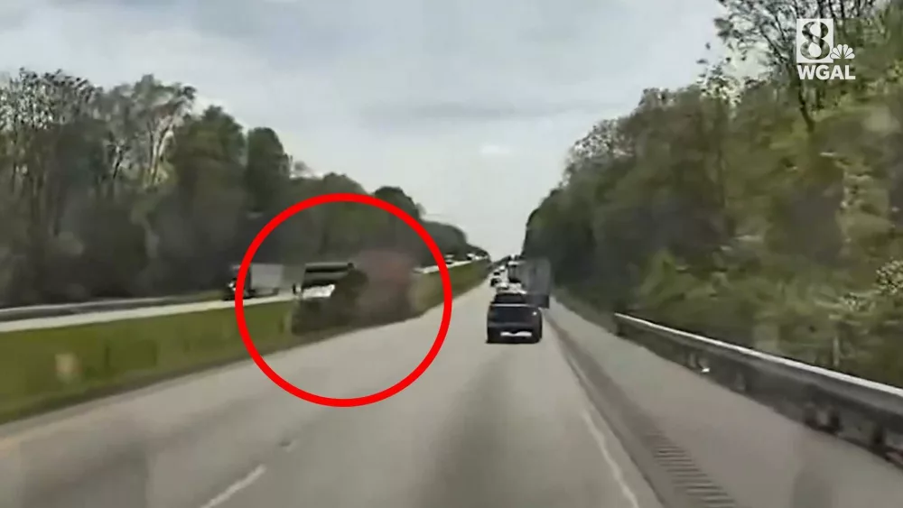 WATCH: Truck nearly plows into ambulance on a Pennsylvania interstate, cable median barrier stops it