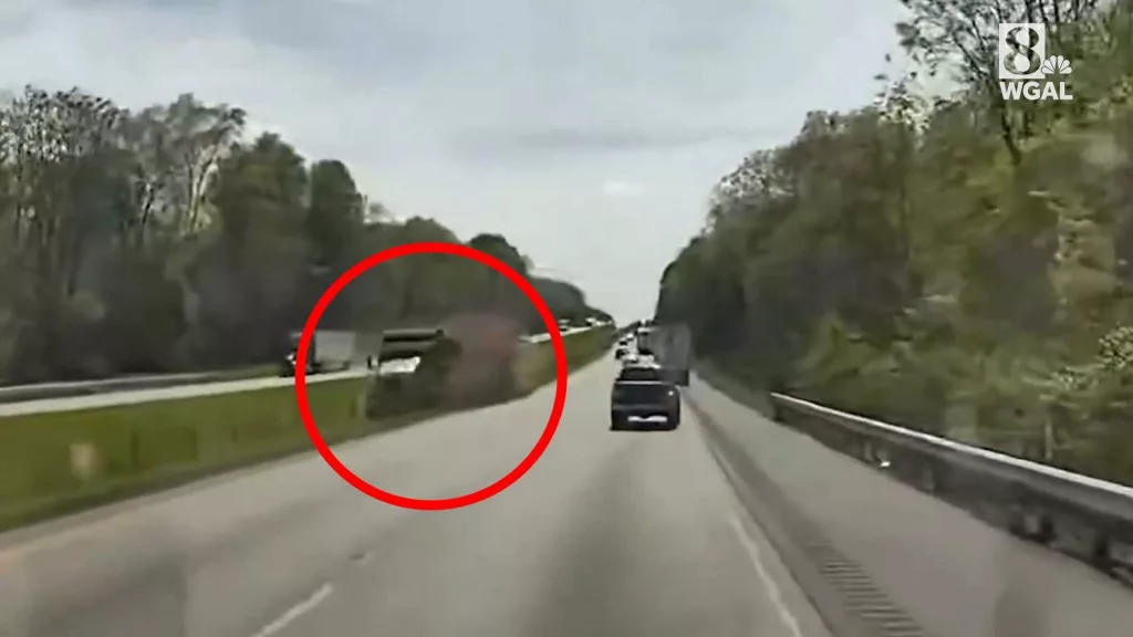 WATCH: Truck nearly plows into ambulance on a Pennsylvania interstate, cable median barrier stops it