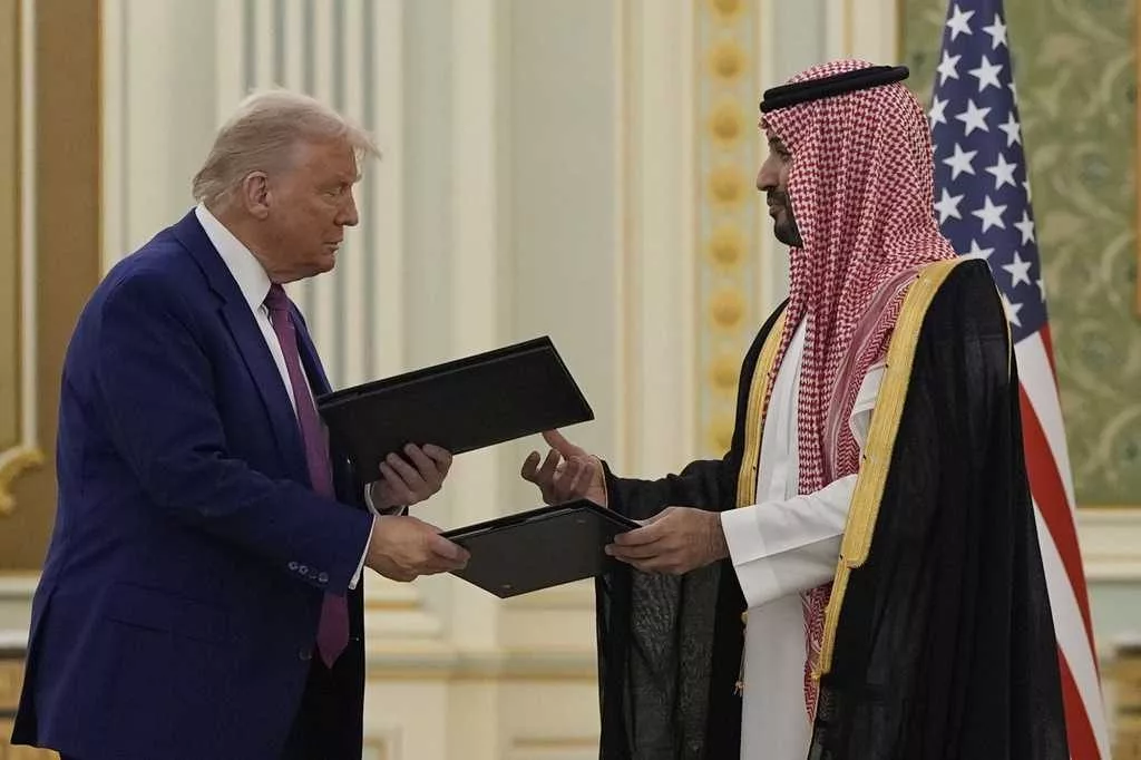Trump and Saudi crown prince sign multiple agreements during Middle East trip