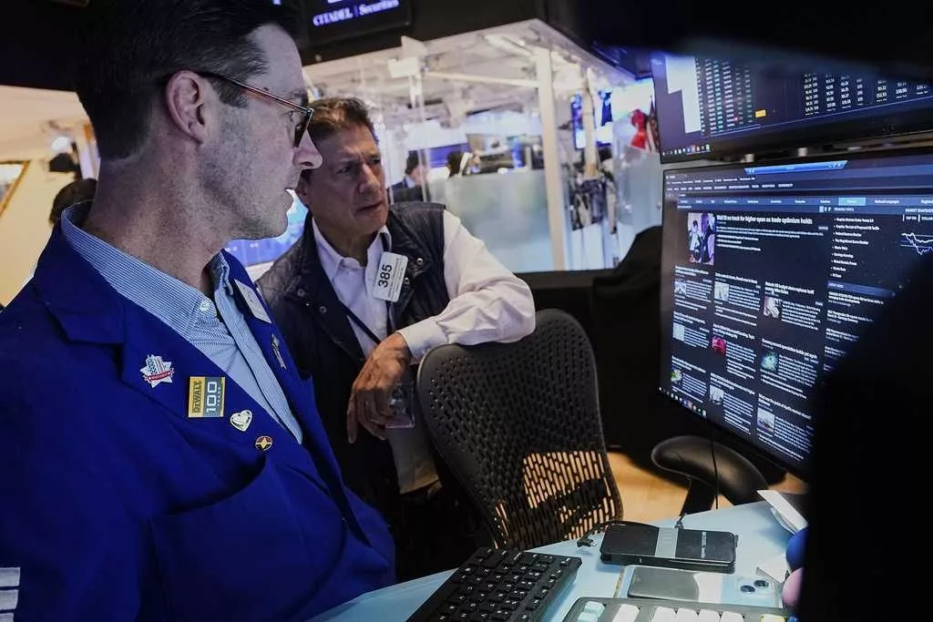 US stocks power within 3% of their record as Wall Street closes out a winning week