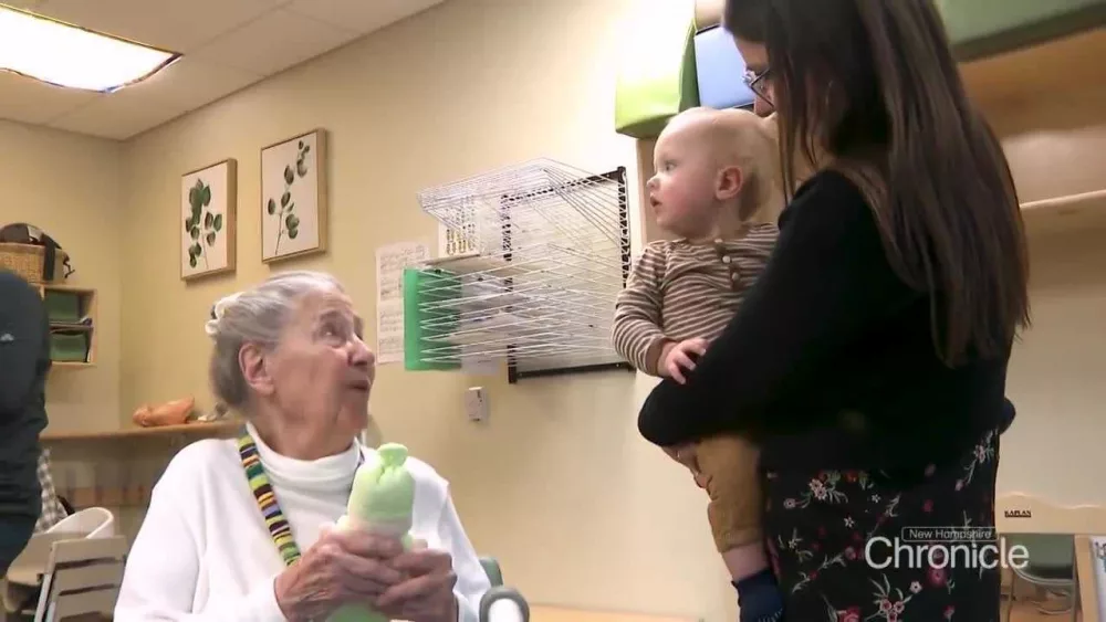 Retirees build bonds with children at on-site learning center as 'grand-friends'