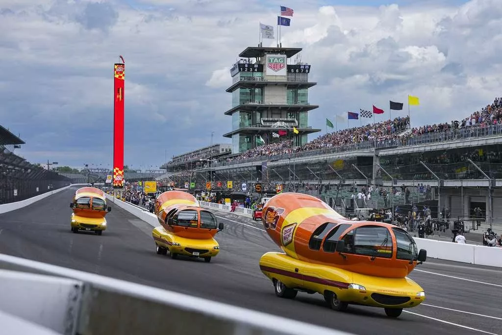 Hot diggity dog! Wienermobiles put on riveting race in Wienie 500 at Indianapolis Motor Speedway