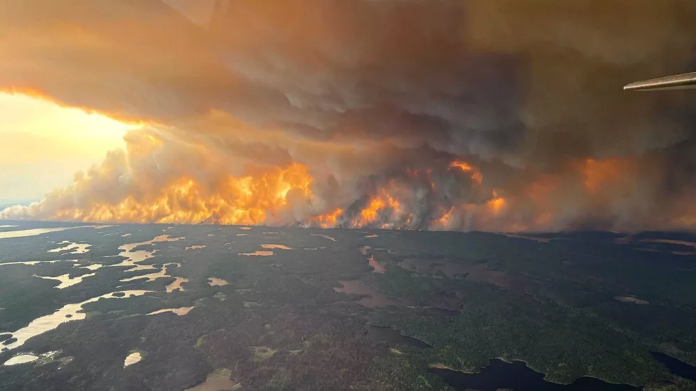 Smoke to pour into the US as Canada wildfires force evacuations