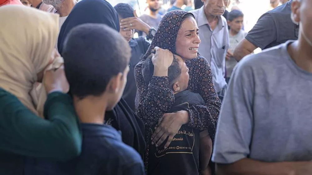 74 killed in Gaza as Israeli forces strike a cafe and fire on people seeking food