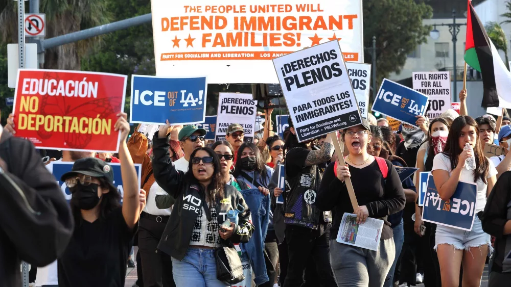 Los Angeles police use tear gas, flash bangs to disperse immigration raid protests