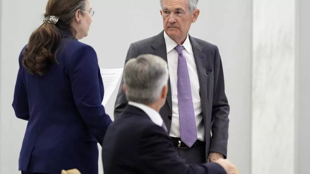 Fed sees 2 interest rate cuts this year while leaving key rate unchanged