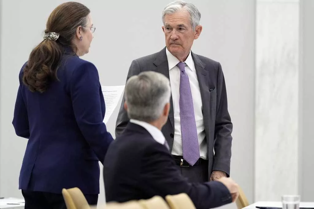 Fed sees 2 interest rate cuts this year while leaving key rate unchanged