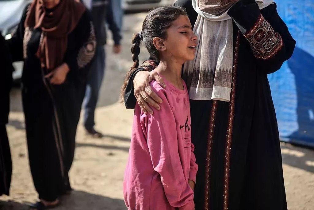 Israel kills 44 waiting for aid as war's death toll passes 56,000, according to authorities