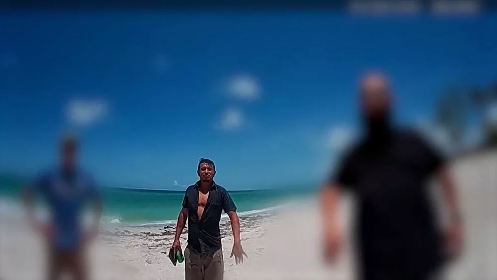 Man who helped save girl after Florida shark attack arrested, may be deported