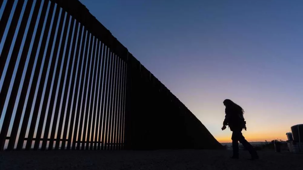 Judge blocks order barring asylum access at border and gives administration two weeks to appeal
