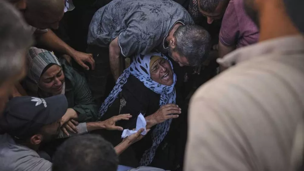 Israeli airstrikes kill 14 Palestinians in Gaza and another 10 die seeking food