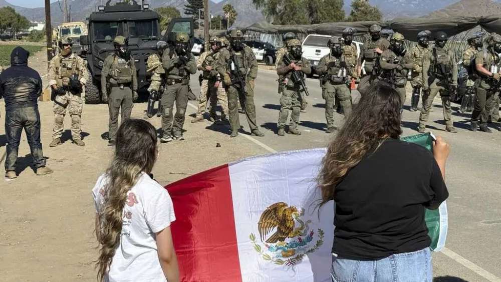 Protesters and federal agents clash during raid at Southern California farm