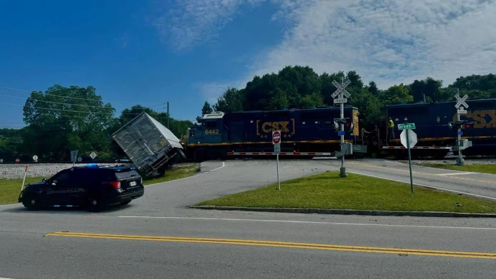 Train collides with semi truck in Georgia, causing hours-long road closures