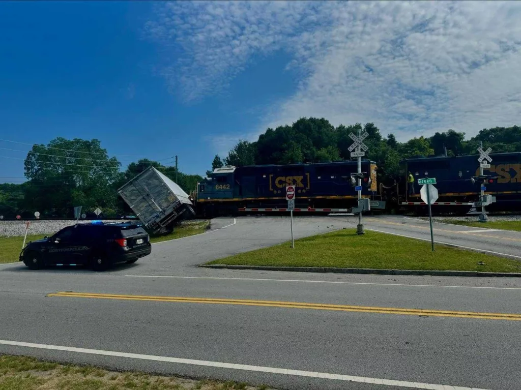 Train collides with semi truck in Georgia, causing hours-long road closures