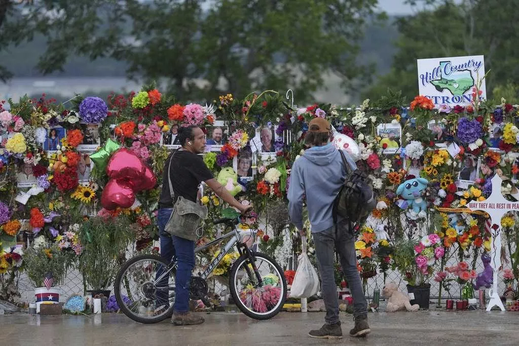 Emergency crews suspend search for flooding victims in central Texas amid new flood warnings.