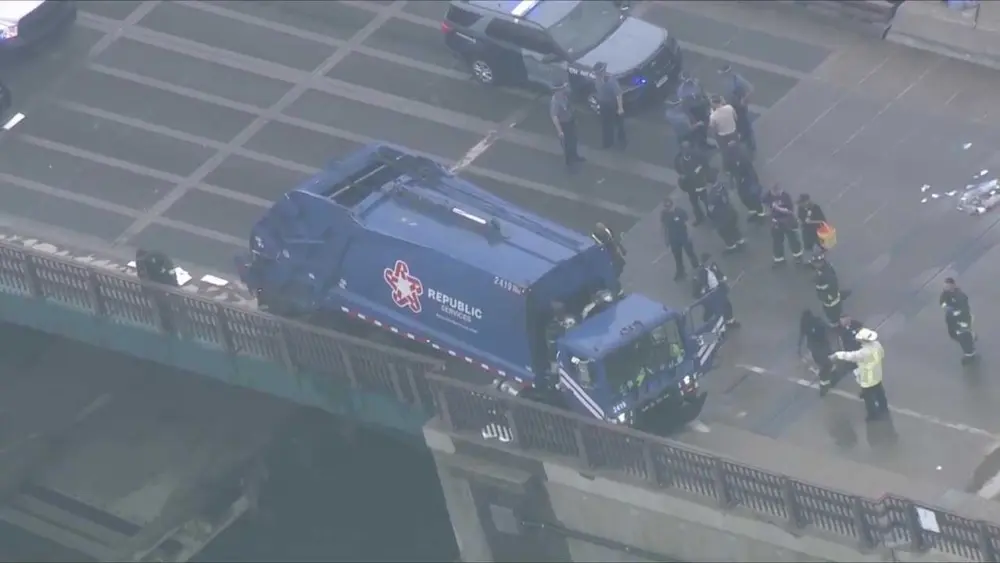 Man accused of stealing garbage truck, crashing on Massachusetts bridge after chase