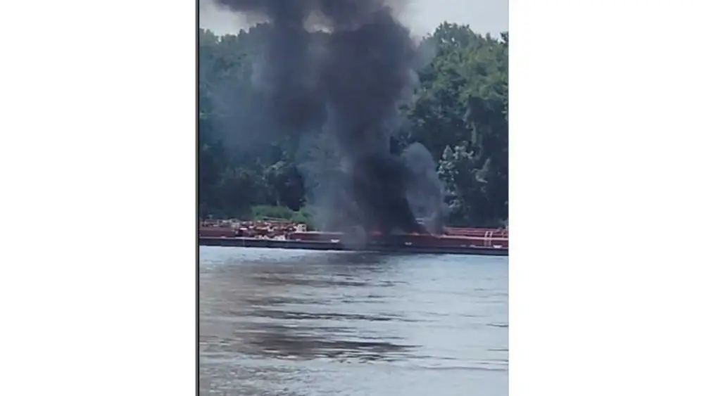 Two die when helicopter crashes into a barge in the Mississippi River