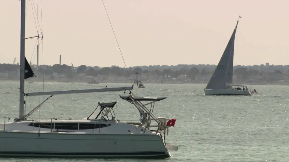 Person pulled from water after boat capsizes off Massachusetts beach dies, state police say