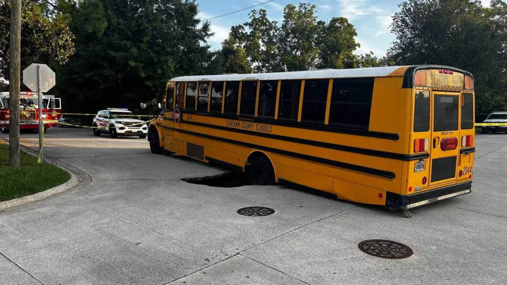 Savannah Police redirect traffic after school bus gets stuck in sinkhole