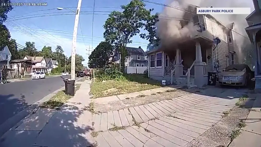 WATCH: Bodycam video shows first responders catching child who jumped from burning home