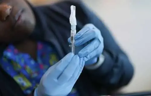FDA approves updated Covid-19 vaccines for limited groups as US cases continue to rise