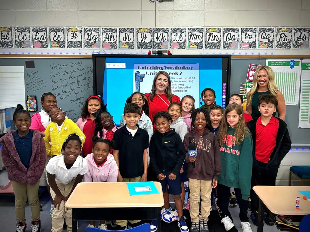 Monica Hynum helps children build confidence in her third grade class at Joseph Martin Elementary