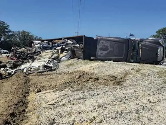 Truck hauling crushed cars overturns, causes diesel leak in Bryan County